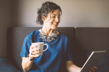 Business woman at home using tablet.