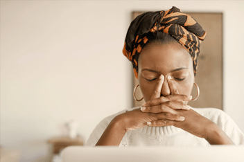 Woman taking a break in front of her computer