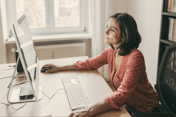 Woman working in home office on her compjuter