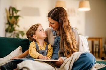 Mom reading story to son