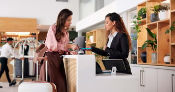 two women at hotel front desk
