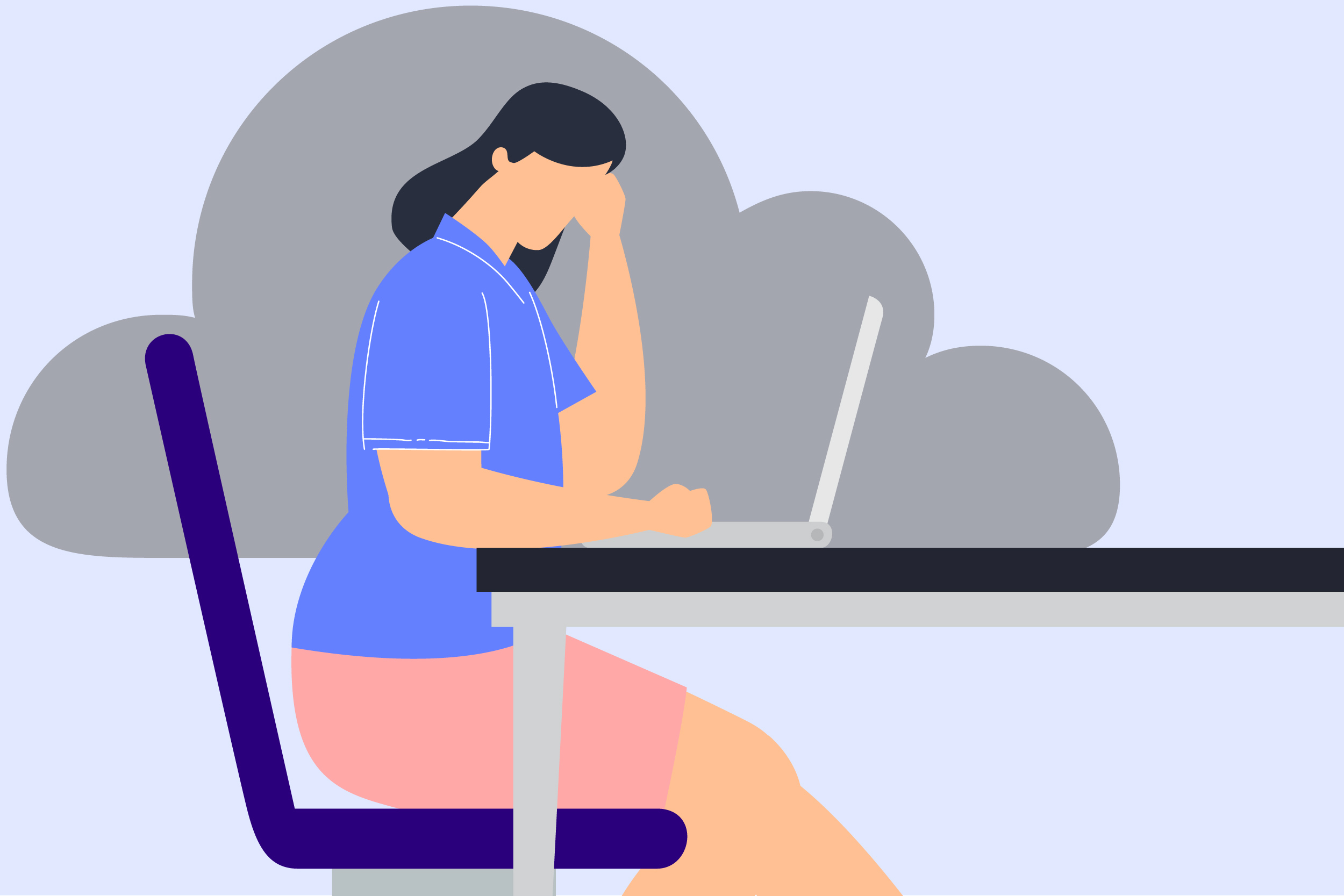 woman at a laptop with a gray cloud over her